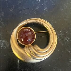 Gold tone Circular Brooch with Red Accent